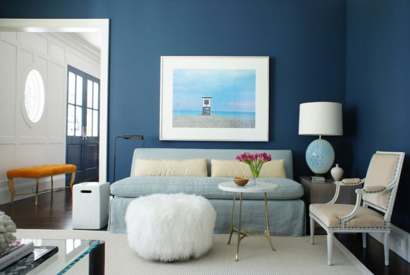 living-room-with-blue-walls-and-soft-furniture-pieces