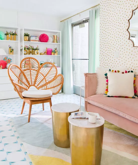 feminine-living-room-with-peacock-chair-dot-wallpaper