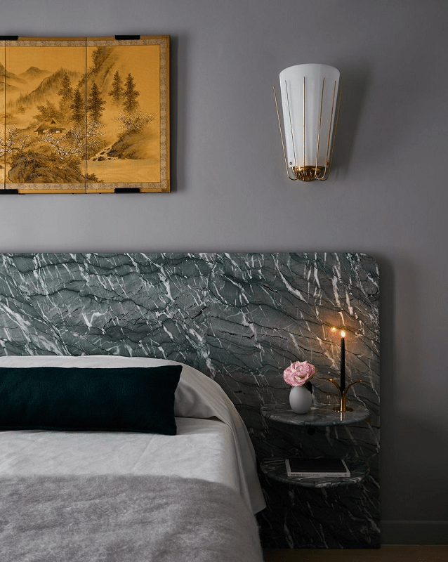 bold-bedroom-with-grey-walls-and-green-marble-headboard-with-a-feel-of-a-hotel-room
