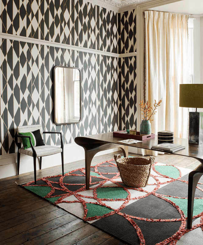 modern-dining-room-with-luxurious-bold-geometric-wallpaper-and-textured-area-rug