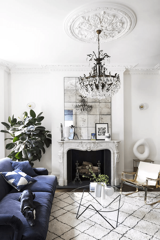 a-living-room-with-a-functional-layout-and-a-french-style-fireplace
