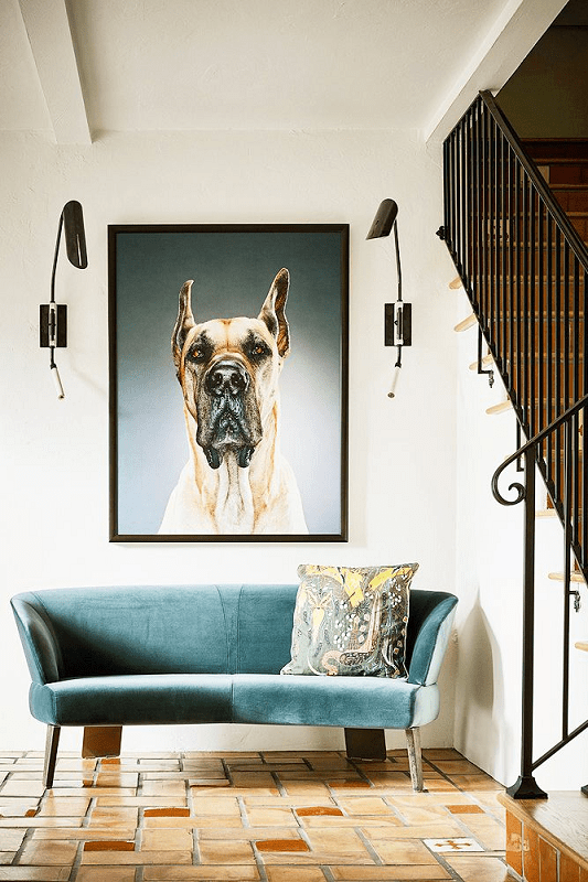modern-foyer-with-blue-sofa-and-oversize-artwork