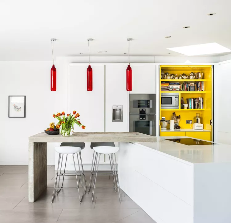 top-best-countertop-surfaces-to-elevate-your-kitchen-white-yellow-modern-kitchen-with-concrete-countertops