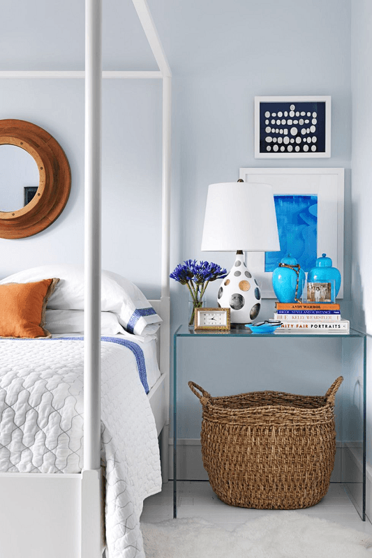 Modern-blue-wall-Decluttered-bedroom-with-glass-night-stand